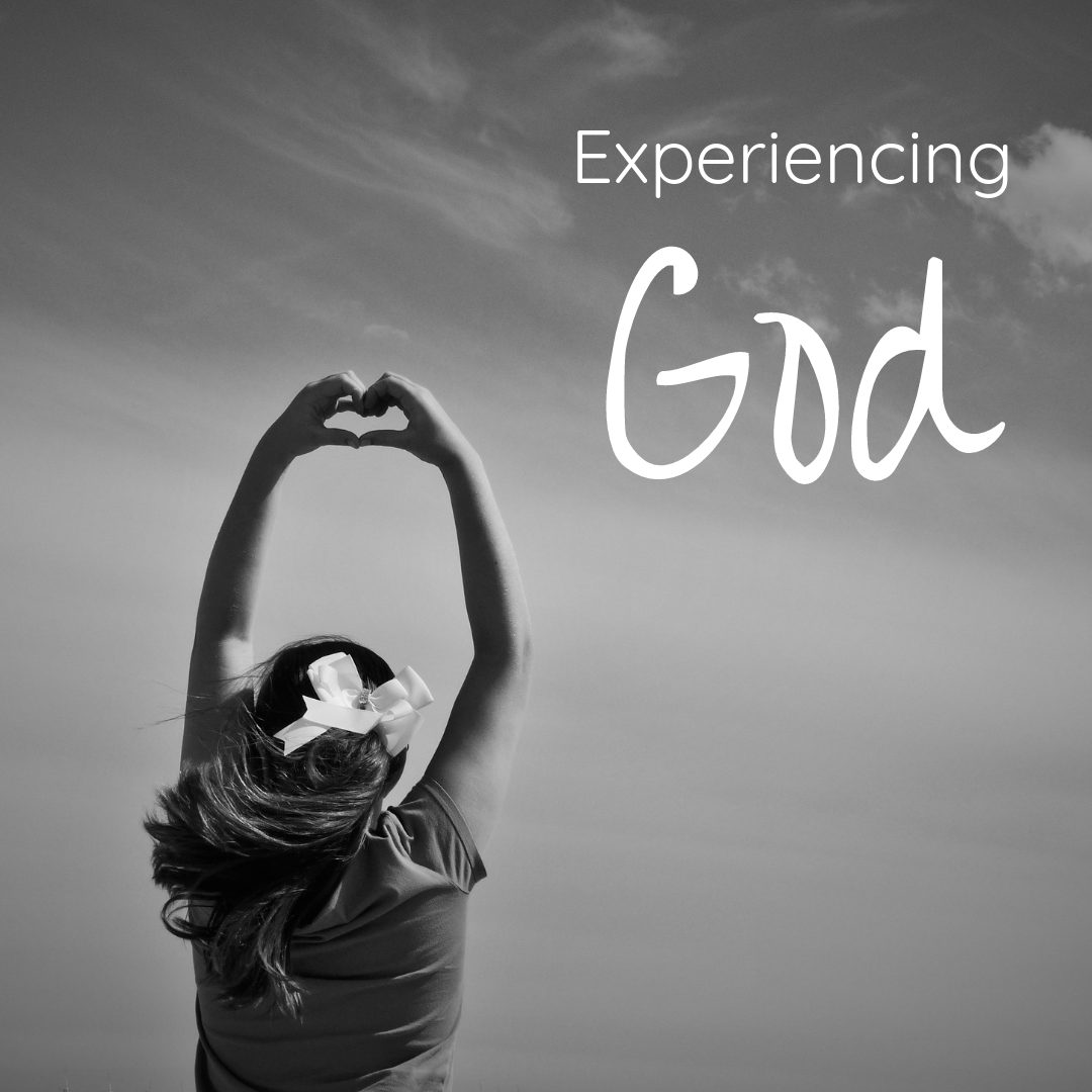 Black and white image of woman holding arms in the air, her hands in the shape of a heart. The words, "experiencing God" are overlaid.